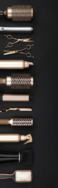 a collection of hair styling tools on a black background