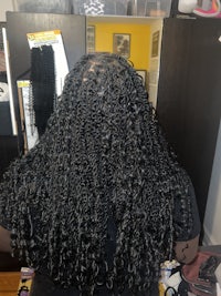 a black cart filled with hair combs and brushes