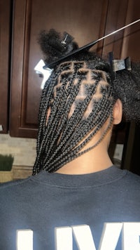 black and white photo of a woman with braided hair