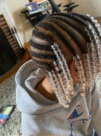 a little girl with braids in her hair