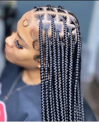 a woman with braided hair in a salon